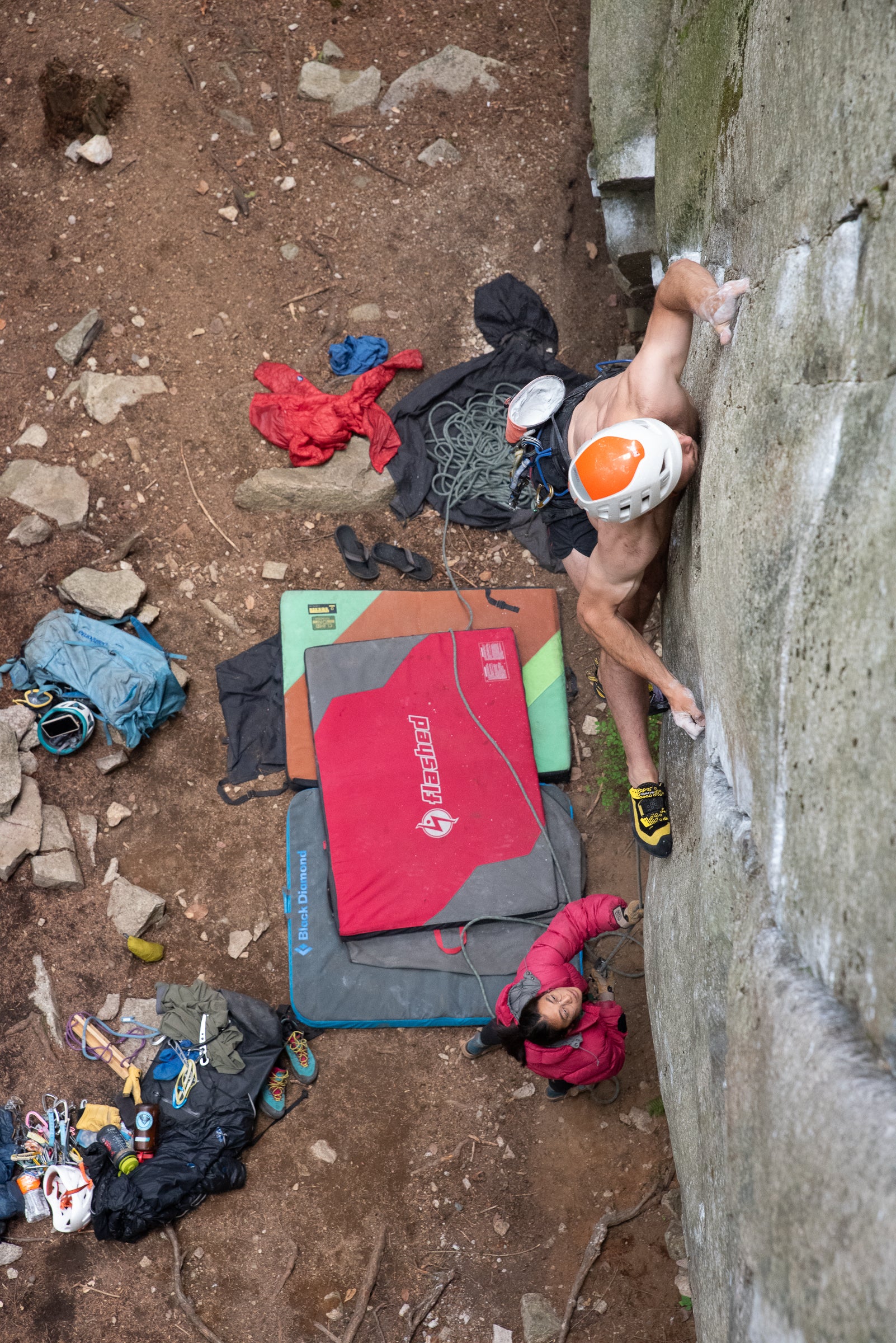 A climber doing a scary vertical trad climb in the Miura VS
