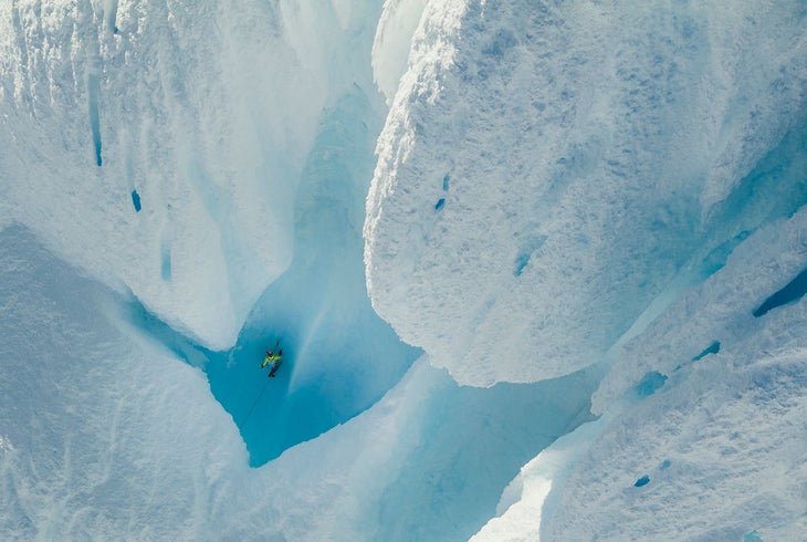 Colin Haley climbs through an otherworldly tube of ice on Cerro Torre's Ragni.